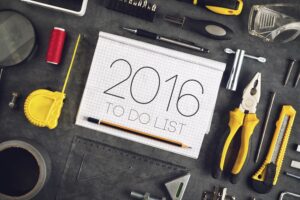 2016, New Year Resolutions Craftsman Workshop Concept with Asorted Tools, Pencil and Notebook for Writing Goals and Aspiration in Following Year